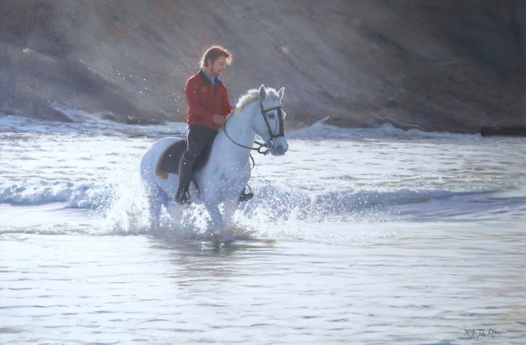 A horse being put through his paces in the sea.