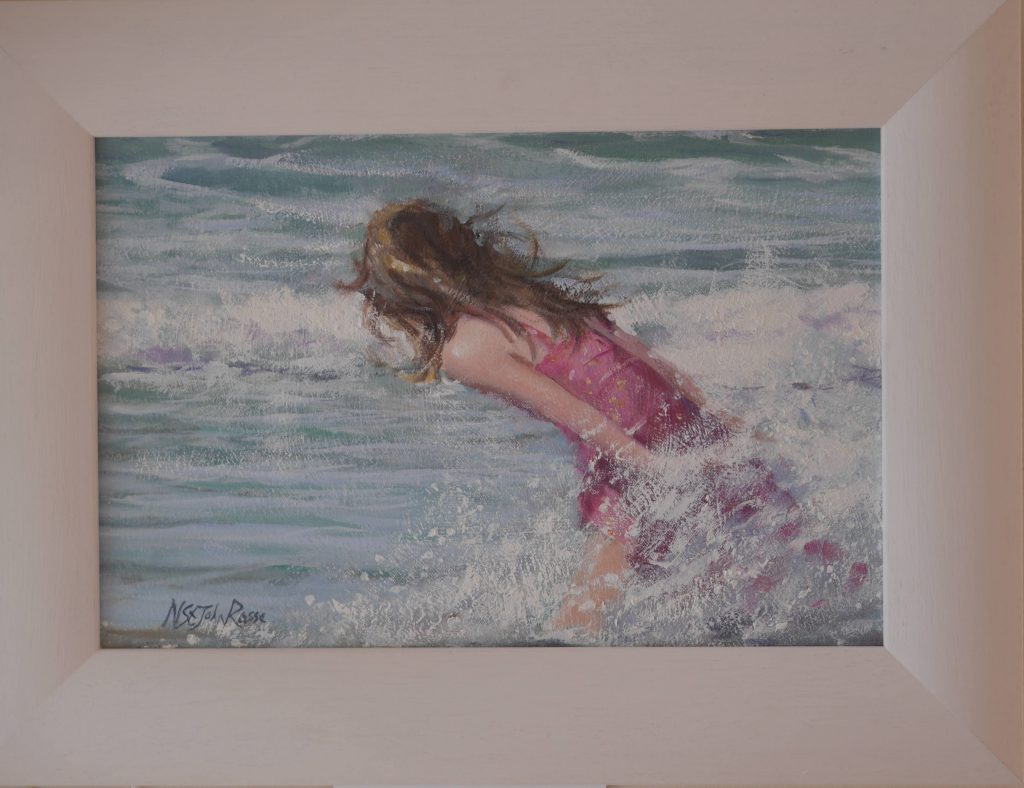a child enjoying the waves